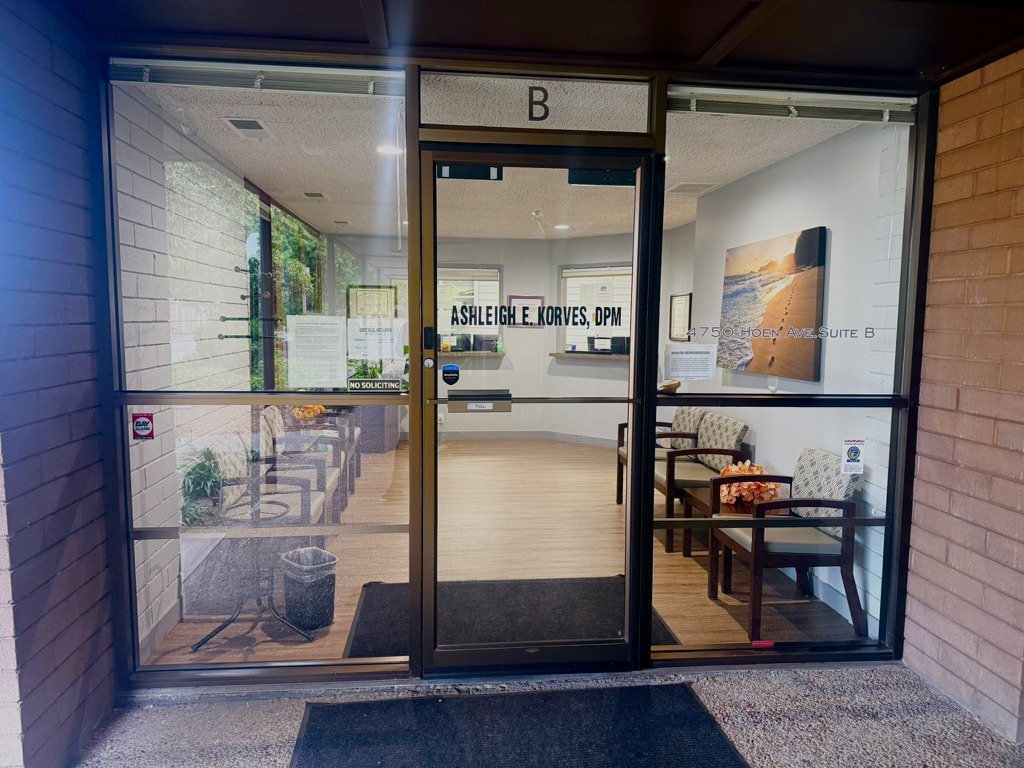 Suite B glass entrance with the practice waiting area visible inside